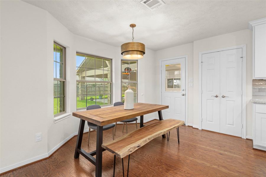 Enjoy an eat-in breakfast area that is tucked in just right next to the curved windows Enjoy an eat-in breakfast area that is tucked in just right next to the curved windows