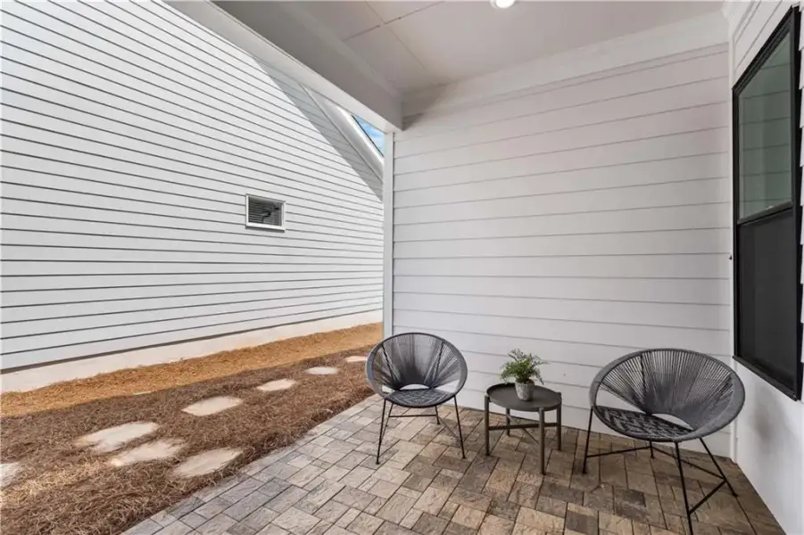 Exterior details and patio area of a home in The Villas at Aberdeen, Hoschton (Image 21). Exterior details and patio area of a home in The Villas at Aberdeen, Hoschton (Image 21).
