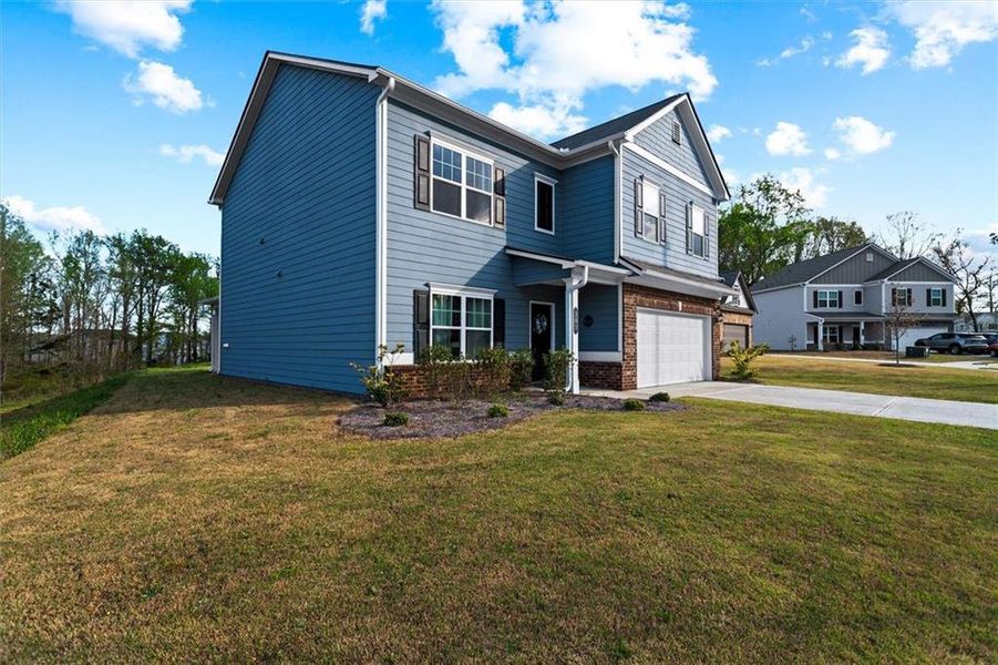 Front exterior of a new home in Garrett Preserve, Hiram, GA, highlighting curb appeal (Image 31).