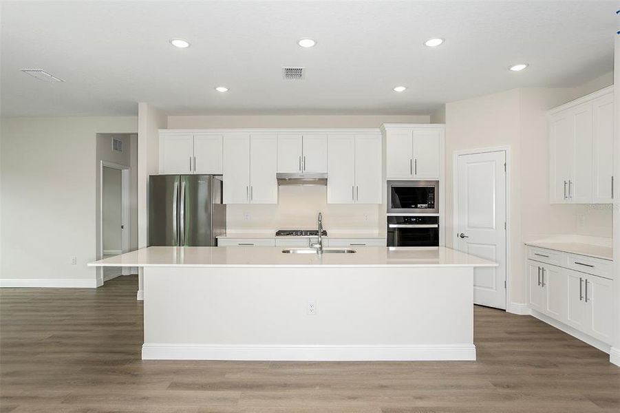 Furnished interior view inside a new home in Pasadena Woods, Dade City (Image 5).