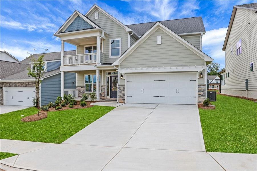 Front exterior of a new home in Twin Lakes, Hoschton, GA, highlighting curb appeal (Image 18). Front exterior of a new home in Twin Lakes, Hoschton, GA, highlighting curb appeal (Image 18).