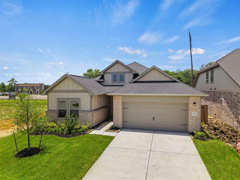 Front exterior of a new home in Laurel Landing, Alvin, TX, highlighting curb appeal (Image 18). Front exterior of a new home in Laurel Landing, Alvin, TX, highlighting curb appeal (Image 18).