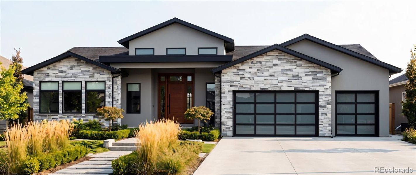 Front exterior of a new home in , Arvada, CO, highlighting curb appeal (Image 1). Front exterior of a new home in , Arvada, CO, highlighting curb appeal (Image 1).