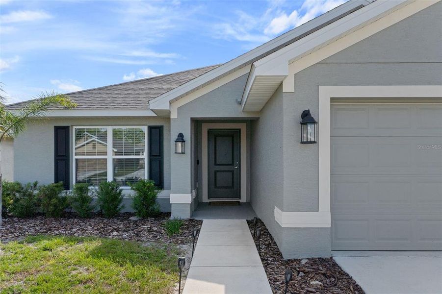 Exterior details and patio area of a home in Pine Bluff, Spring Hill (Image 4).