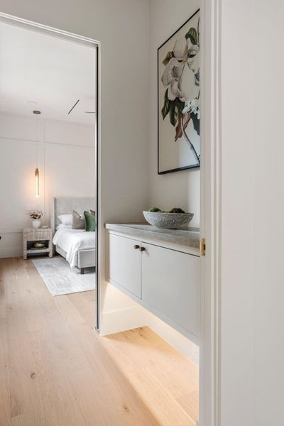 Vestibule appointed with floating built-in and warm under-lighting for a hotel-like sense of arrival into the priamry suite. Vestibule appointed with floating built-in and warm under-lighting for a hotel-like sense of arrival into the priamry suite.