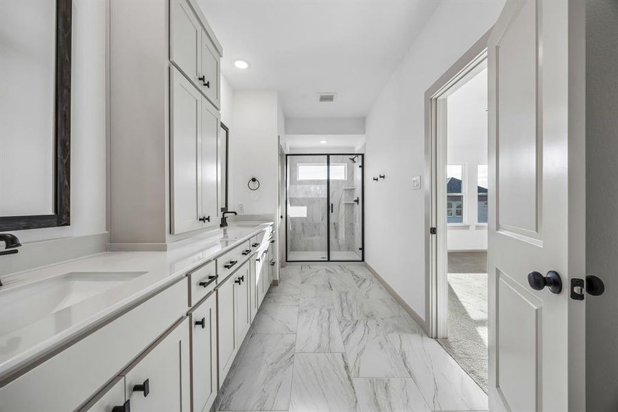 The spacious walk in shower is the cherry on top in this luxuriously finished owner's bath!