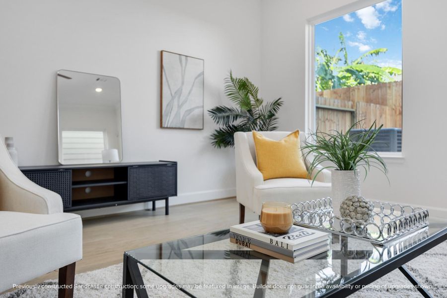 This cozy corner is all about the details—designer trim, crown molding, and gorgeous wood-look flooring set the scene for stylish, everyday living.