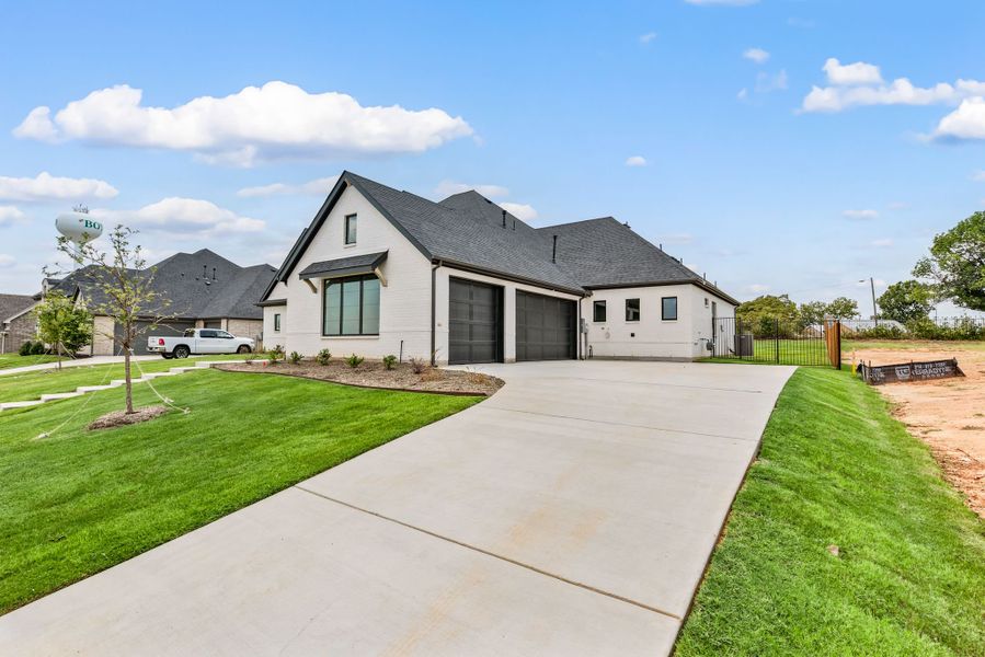 Front exterior of a new home in Highland Oaks, Boyd, TX, highlighting curb appeal (Image 2).