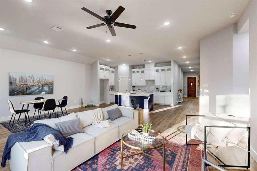 Living room featuring hardwood / wood-style flooring and ceiling fan