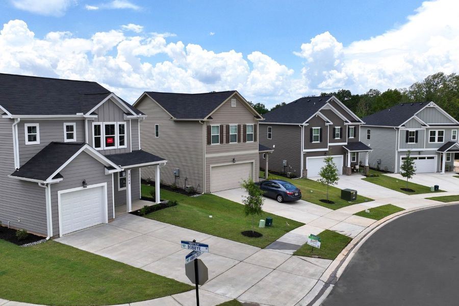 Front exterior of a new home in Forrest Bluff, North Augusta, SC, highlighting curb appeal (Image 2). Front exterior of a new home in Forrest Bluff, North Augusta, SC, highlighting curb appeal (Image 2).
