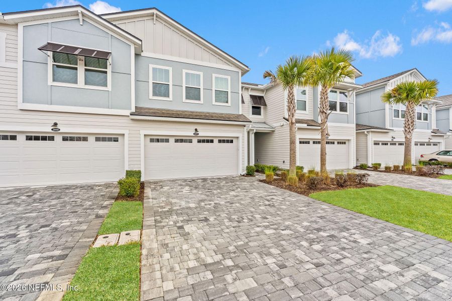 Front exterior of a new home in Pablo Cove, Jacksonville, FL, highlighting curb appeal (Image 22).