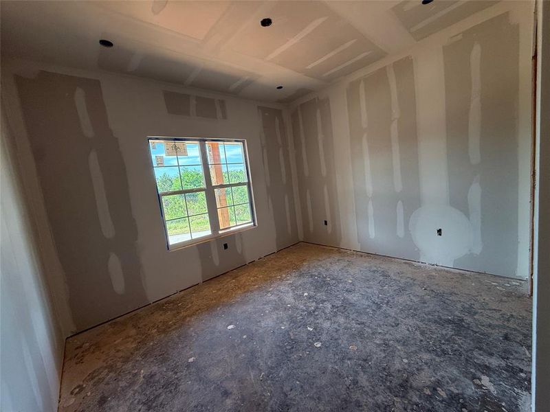 Room under construction featuring an installed double-pane window, recessed ceiling lighting, and newly hung drywall Room under construction featuring an installed double-pane window, recessed ceiling lighting, and newly hung drywall