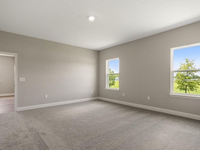 Relax and unwind in your spacious owner`s suite - Monroe 55+ by Highland Homes