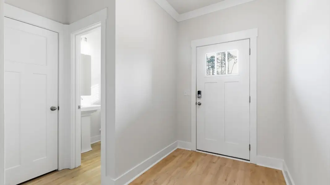 Established style and superior craftsmanship evident from the hardwood foyer entry at this villa in Greenville, SC
