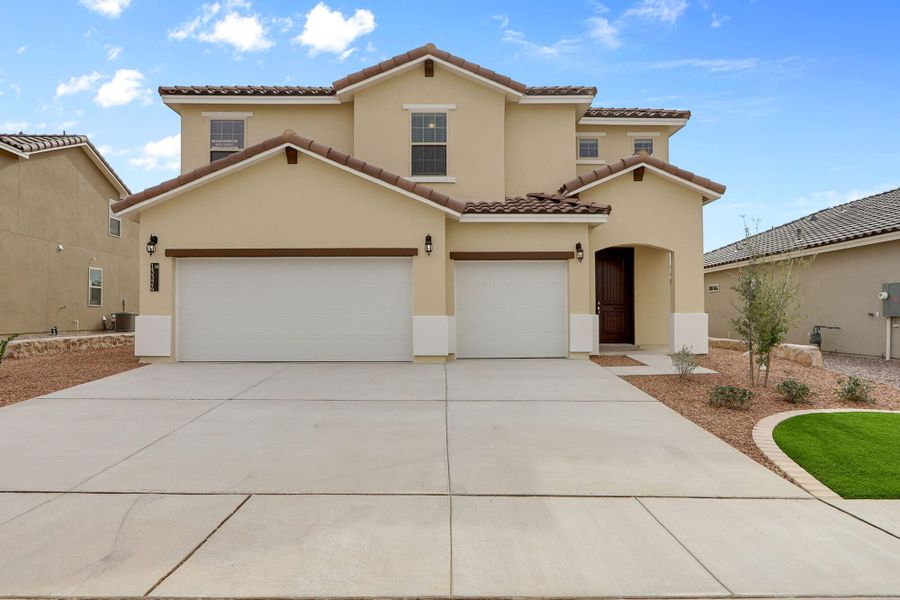 Front exterior of a new home in Emerald Estates, Horizon City, TX, highlighting curb appeal (Image 25). Front exterior of a new home in Emerald Estates, Horizon City, TX, highlighting curb appeal (Image 25).