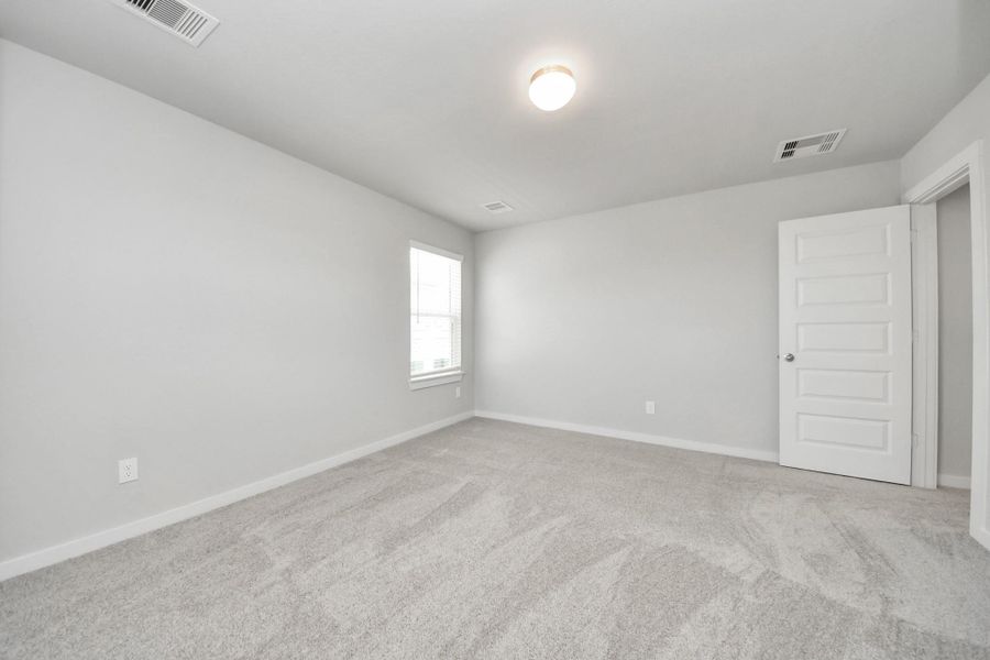 Secondary bedroom features plush carpeting, large windows that let in plenty of natural light, bright paint, and spacious closets. Secondary bedroom features plush carpeting, large windows that let in plenty of natural light, bright paint, and spacious closets.