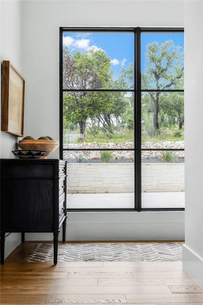 Doorway to outside with light wood-type flooring