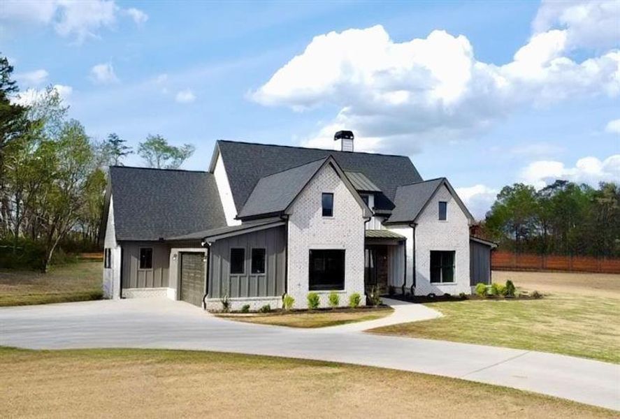 Front exterior of a new home in , Rydal, GA, highlighting curb appeal (Image 2).