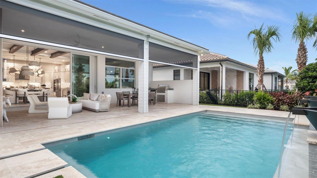 Exterior details and patio area of a home in L'Ambiance at Avenir, Palm Beach Gardens (Image 3).