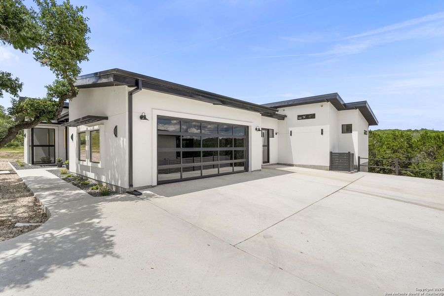Front exterior of a new home in , Spring Branch, TX, highlighting curb appeal (Image 26).