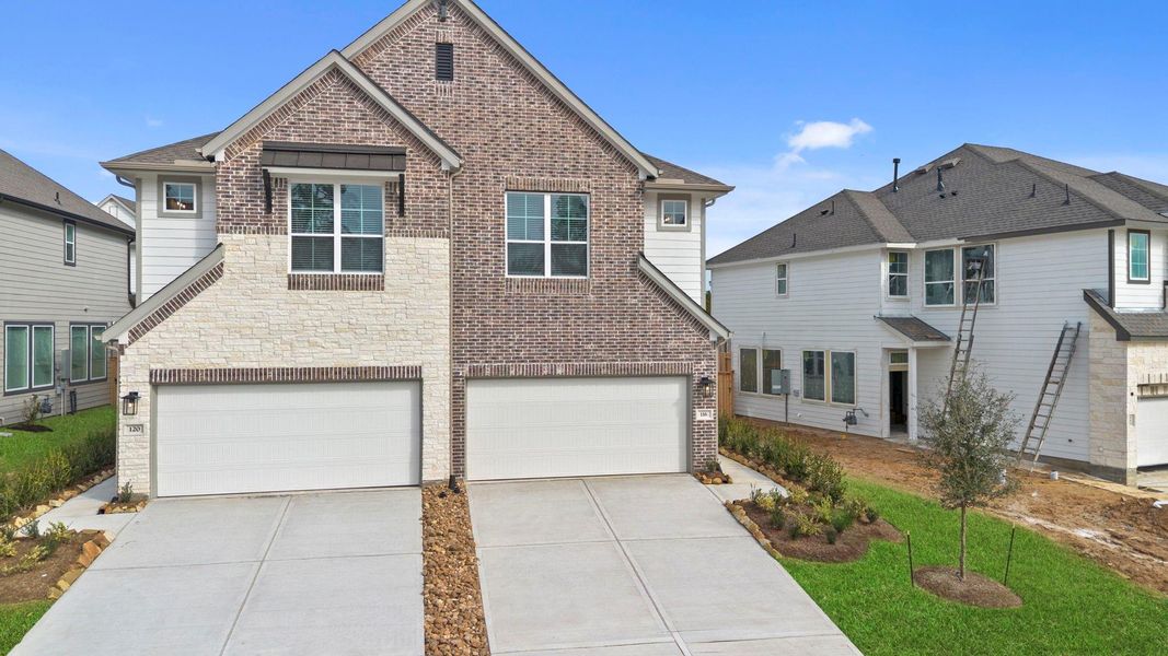 Front exterior of a new home in Woodforest, Montgomery, TX, highlighting curb appeal (Image 22). Front exterior of a new home in Woodforest, Montgomery, TX, highlighting curb appeal (Image 22).