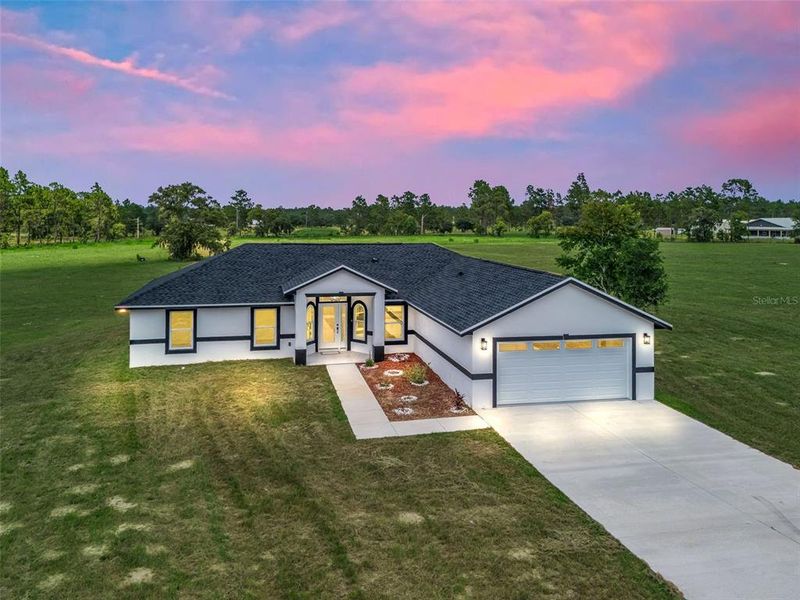 Front exterior of a new home in , Morriston, FL, highlighting curb appeal (Image 1). Front exterior of a new home in , Morriston, FL, highlighting curb appeal (Image 1).