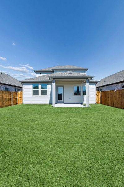 Covered Patio in the Mesquite home plan by Trophy Signature Homes – REPRESENTATIVE PHOTO