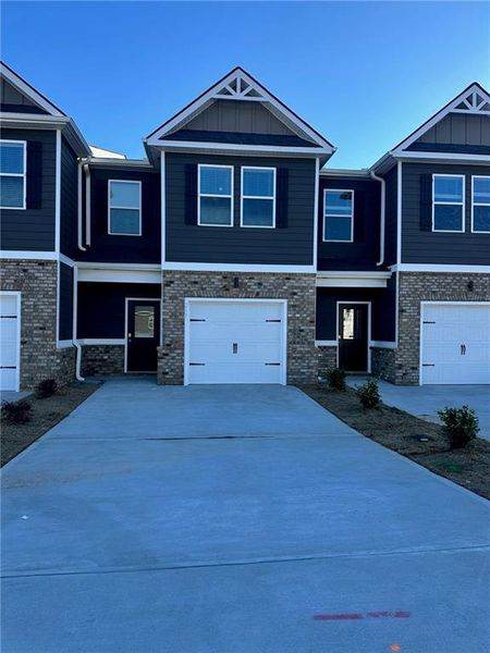 Front exterior of a new home in Azalea Hills, Temple, GA, highlighting curb appeal (Image 1). Front exterior of a new home in Azalea Hills, Temple, GA, highlighting curb appeal (Image 1).