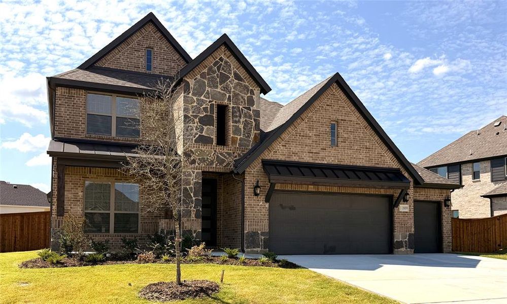 Front exterior of a new home in Wildcat Ridge, Godley, TX, highlighting curb appeal (Image 1). Front exterior of a new home in Wildcat Ridge, Godley, TX, highlighting curb appeal (Image 1).