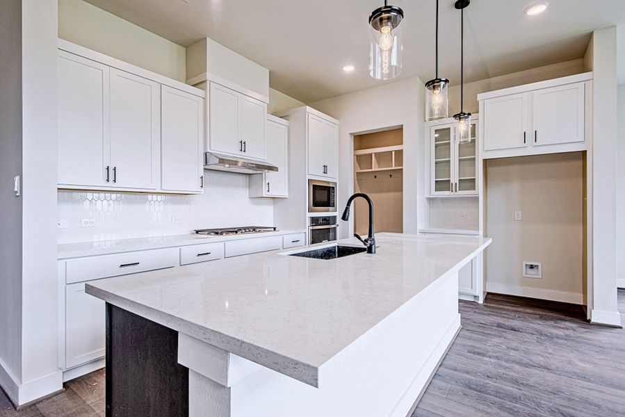Gourmet kitchen featuring a large island and ample prep space Gourmet kitchen featuring a large island and ample prep space