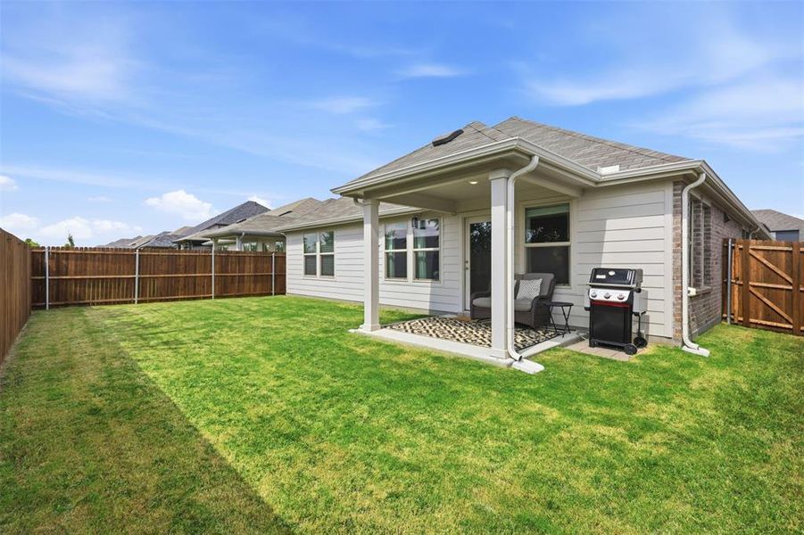 Exterior details and patio area of a home in Tesoro at Chisholm Trail Ranch, Crowley (Image 23).