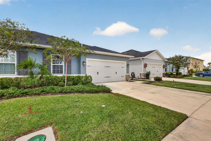 Front exterior of a new home in , Port St. Lucie, FL, highlighting curb appeal (Image 1). Front exterior of a new home in , Port St. Lucie, FL, highlighting curb appeal (Image 1).
