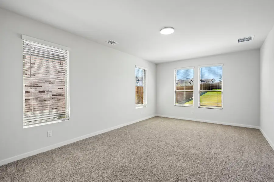 Primary Bedroom in the Wimbledon home plan by Trophy Signature Homes