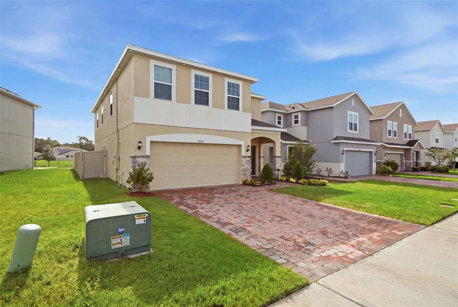 Front exterior of a new home in , Kissimmee, FL, highlighting curb appeal (Image 2). Front exterior of a new home in , Kissimmee, FL, highlighting curb appeal (Image 2).