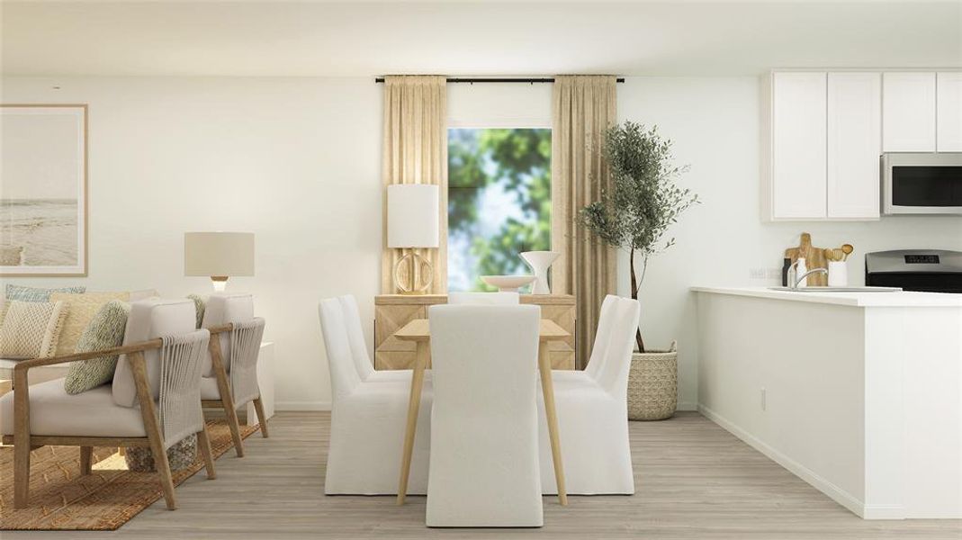 Dining room with light hardwood / wood-style flooring