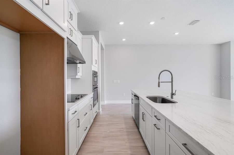 Furnished interior view inside a new home in Esplanade at Westview, Kissimmee (Image 9).