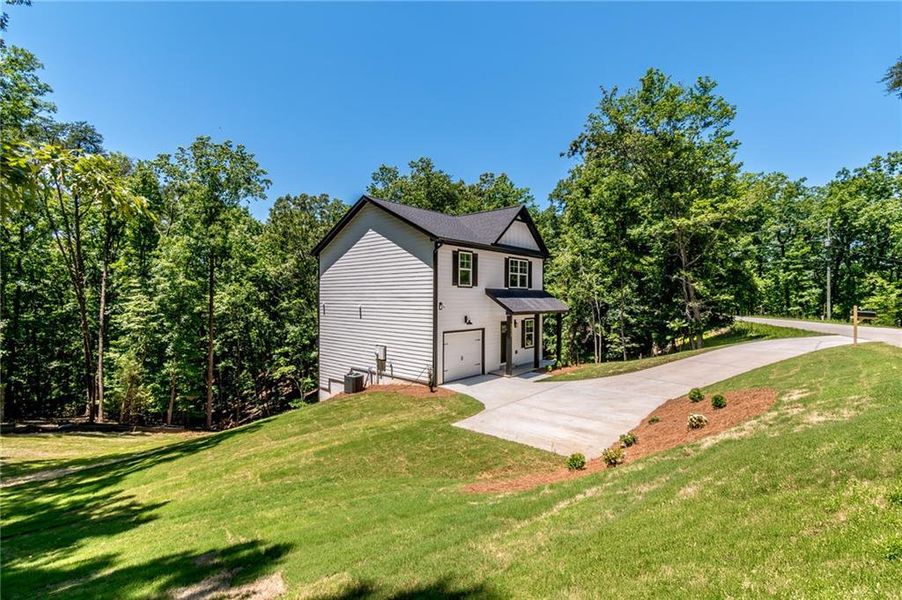 Front exterior of a new home in , Gainesville, GA, highlighting curb appeal (Image 19). Front exterior of a new home in , Gainesville, GA, highlighting curb appeal (Image 19).