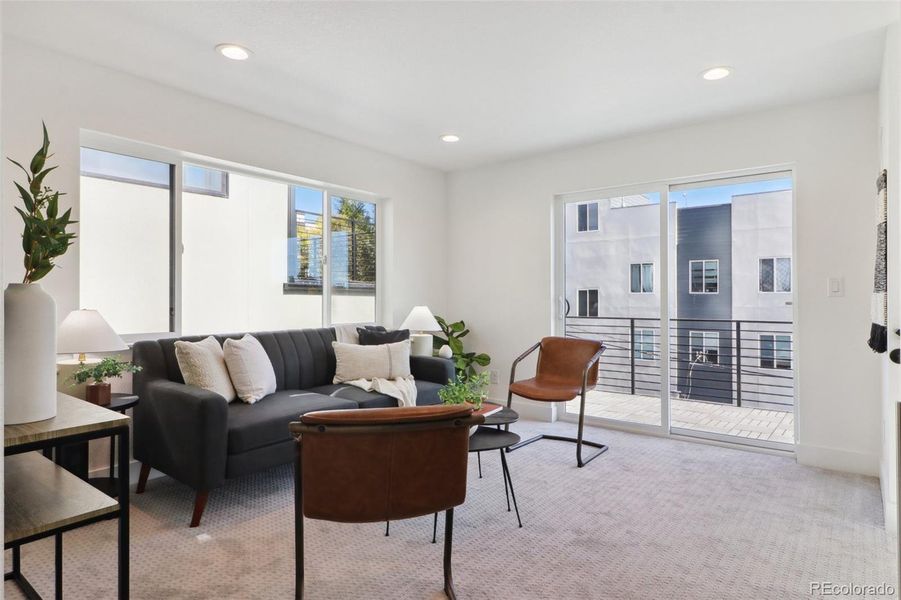 Third floor bonus room with wet bar, opening to walk out deck