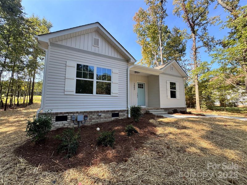 Front exterior of a new home in , Monroe, NC, highlighting curb appeal (Image 16).