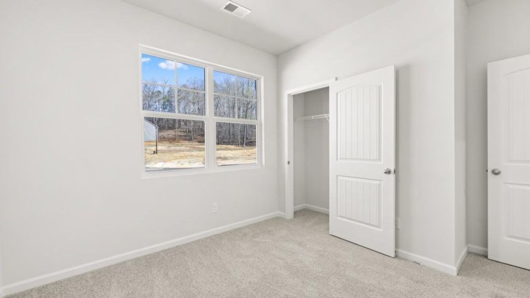Spacious, unfurnished interior of a new home in South Wind, Fairburn (Image 16).