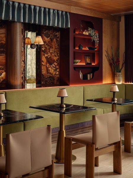 Rich wood paneling, intricate wall coverings, and integrated shelving create an intimate atmosphere. Rich wood paneling, intricate wall coverings, and integrated shelving create an intimate atmosphere.