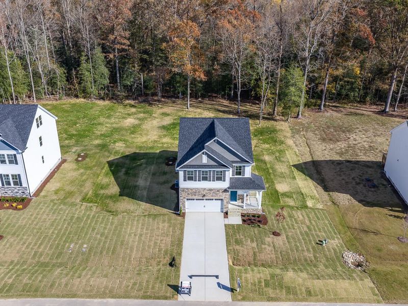 Front exterior of a new home in Wellers Knoll, Lillington, NC, highlighting curb appeal (Image 2).