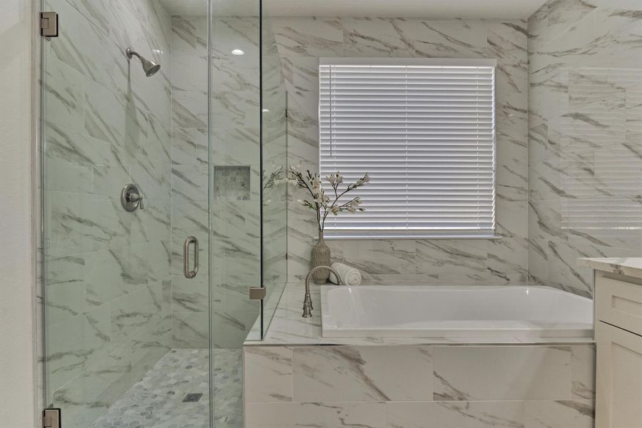 Relax in the spa-like tub or enjoy the separate walk-in shower. Relax in the spa-like tub or enjoy the separate walk-in shower.