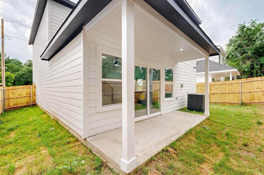Rear view of property featuring a patio area and a fenced backyard Rear view of property featuring a patio area and a fenced backyard