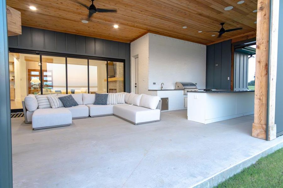 View of patio with ceiling fan, exterior kitchen, and outdoor lounge area View of patio with ceiling fan, exterior kitchen, and outdoor lounge area