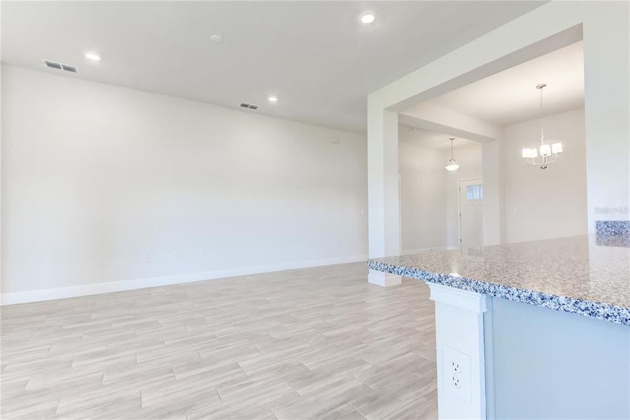 Spacious, unfurnished interior of a new home in Aviary at Rutland Ranch, Parrish (Image 29).
