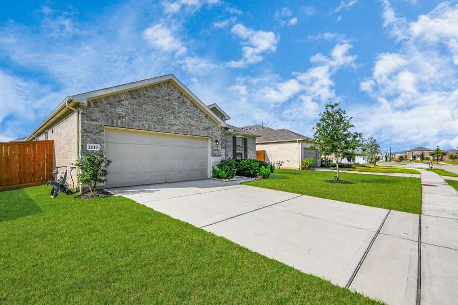 Front exterior of a new home in Marvida, Cypress, TX, highlighting curb appeal (Image 26).