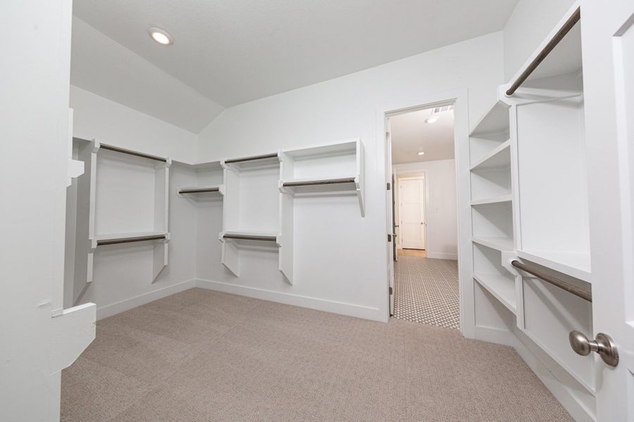 Look at this immaculate closet! With high shelving, multiple rows to hang clothing, you are sure to have enough room for all your belongings!