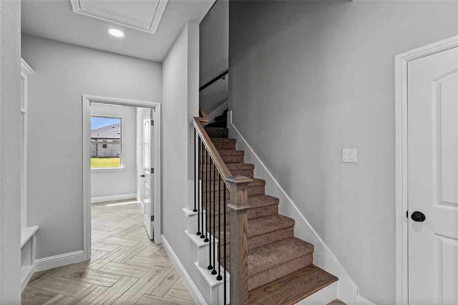 Stairs featuring recessed lighting and baseboards Stairs featuring recessed lighting and baseboards