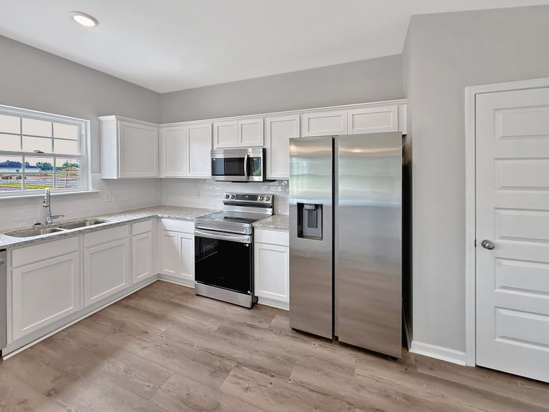 Furnished interior view inside a new home in The Village at Sassafras, Allenhurst (Image 7).